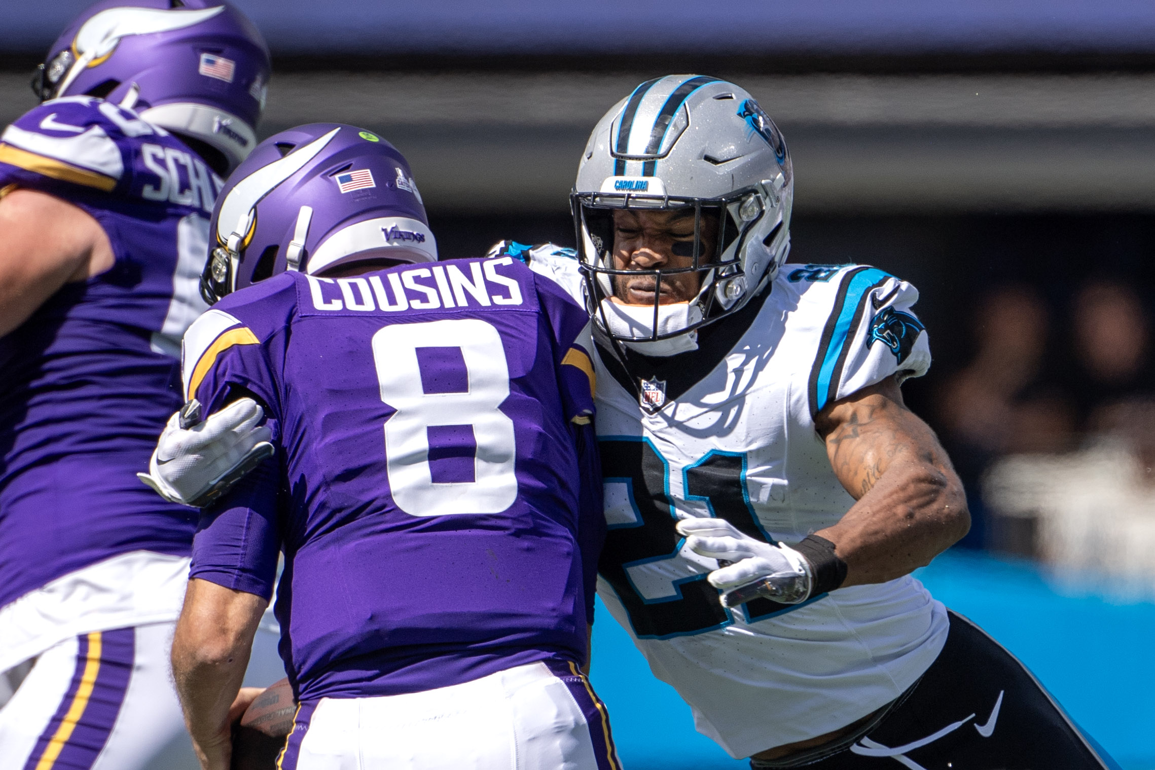 Oct 1, 2023; Charlotte, North Carolina, USA; Carolina Panthers safety Jeremy Chinn (21) sacks Minnesota Vikings quarterback Kirk Cousins (8) in the second quarter at Bank of America Stadium.